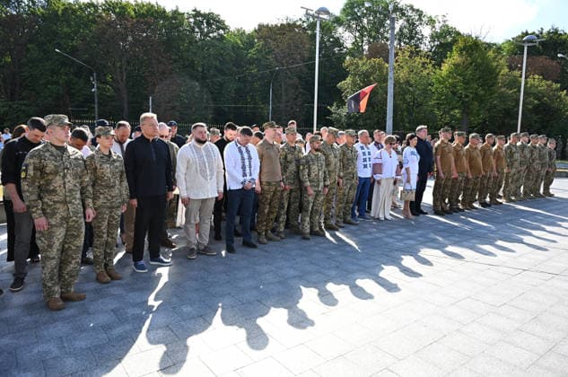 National Flag Day of Ukraine in Lviv LVIV, UKRAINE - AUGUST 23: Ukrainian servicemen and civilians observe a minute of silence during a National Flag Day ceremony in Lviv, Ukraine, on August 23, 2026. Due to the ongoing Russian-Ukrainian War, celebrations were limited to a ceremonial raising of the Ukrainian flag on the city s highest flagpole with the participation of soldiers from various branches of the armed forces. Participants also sang the Ukrainian national anthem, while a military orchestra performed patriotic and folk songs. Michael Sorrow Anadolu Lviv Ukraine. Editorial use only. Please get in touch for any other usage.  Copyright: x2026xAnadoluxMichaelxSorrowx
