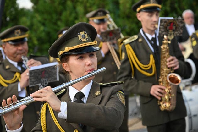 National Flag Day of Ukraine in Lviv LVIV, UKRAINE - AUGUST 23: A member of a Ukrainian military orchestra performs during a National Flag Day ceremony in Lviv, Ukraine, on August 23, 2026. Due to the ongoing Russian-Ukrainian War, celebrations were limited to a ceremonial raising of the Ukrainian flag on the city s highest flagpole with the participation of soldiers from various branches of the armed forces. Participants also observed a minute of silence for those killed, sang the Ukrainian national anthem, and listened to patriotic and folk songs performed by a military orchestra. Michael Sorrow Anadolu Lviv Ukraine. Editorial use only. Please get in touch for any other usage.  Copyright: x2026xAnadoluxMichaelxSorrowx