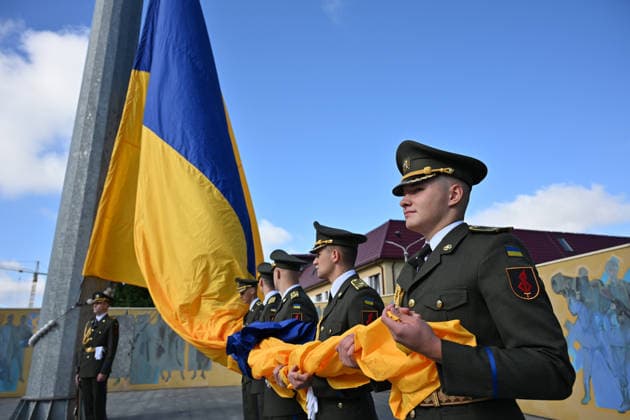 National Flag Day of Ukraine in Lviv LVIV, UKRAINE - AUGUST 23: Celebration of the National Flag Day of Ukraine during the Russian-Ukrainian War in Lviv, Ukraine on August 23, 2026. Due to the war, only the ceremonial raising of the Ukrainian flag on the highest flagpole in the city with the participation of soldiers from various branches of the armed forces took place. People also honored the fallen with a minute of silence, sang the Ukrainian anthem, and a military orchestra played several patriotic and folk songs. Michael Sorrow Anadolu Lviv Ukraine. Editorial use only. Please get in touch for any other usage.  Copyright: x2026xAnadoluxMichaelxSorrowx