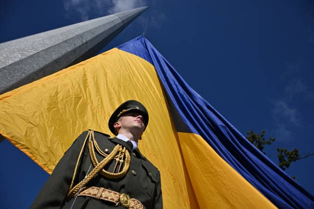 National Flag Day of Ukraine in Lviv LVIV, UKRAINE - AUGUST 23: Celebration of the National Flag Day of Ukraine during the Russian-Ukrainian War in Lviv, Ukraine on August 23, 2026. Due to the war, only the ceremonial raising of the Ukrainian flag on the highest flagpole in the city with the participation of soldiers from various branches of the armed forces took place. People also honored the fallen with a minute of silence, sang the Ukrainian anthem, and a military orchestra played several patriotic and folk songs. Michael Sorrow Anadolu Lviv Ukraine. Editorial use only. Please get in touch for any other usage.  Copyright: x2026xAnadoluxMichaelxSorrowx