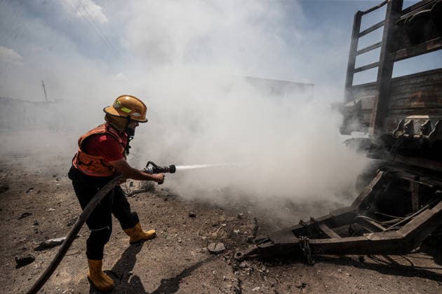 Israeli attacks on Gaza continue despite ceasefire GAZA STRIP, GAZA, PALESTINE - AUGUST 23: A firefighter intervenes to extinguish several vehicles that caught fire following an Israeli airstrike that destroyed several homes and tents where displaced Palestinians were staying in Zuvayda, Gaza Strip, Palestine, on August 23, 2026. Ali Jadallah Anadolu Gaza Strip Gaza. Editorial use only. Please get in touch for any other usage.  Copyright: x2026xAnadoluxAlixJadallahx