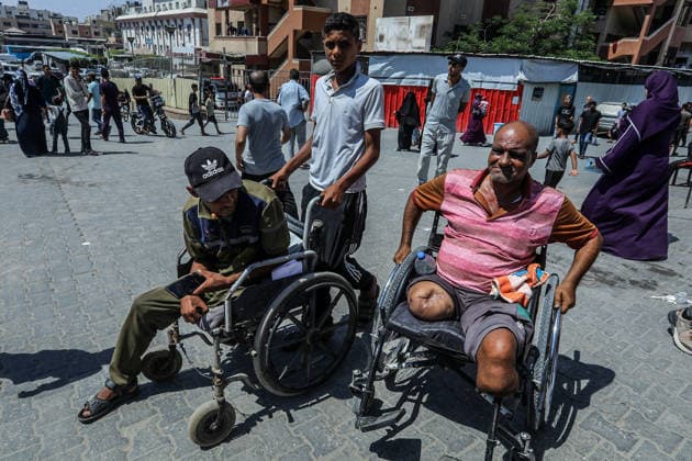 Patients and injured Palestinians in Gaza protest for medical treatment abroad KHAN YUNIS, GAZA, PALESTINE - AUGUST 23: Men in a wheelchair are seen as Palestinian patients and injured people gather outside Nasser Hospital to protest and demand permission to leave the Gaza Strip for medical treatment abroad in Khan Yunis, southern Gaza, Palestine, on August 23, 2026. Demonstrators say the health conditions of patients who have been waiting for a long time are deteriorating due to Israel allowing only limited passage through border crossings, and call for permission to leave Gaza for medical treatment. Abed Rahim Khatib Anadolu Khan Yunis Gaza. Editorial use only. Please get in touch for any other usage.  Copyright: x2026xAnadoluxAbedxRahimxKhatibx