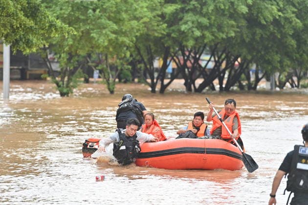 (260823) -- NINGMING, Aug. 23, 2026 -- Rescuers transfer stranded residents in Ningming County, south China s Guangxi Zhuang Autonomous Region, Aug. 23, 2026. For days, Ningming County has been battered by typhoon-triggered heavy rainfall. Response forces have pooled their efforts to urgently evacuate stranded residents. ) CHINA-GUANGXI-TYPHOON-STRANDED RESIDENTS-TRANSFER (CN) ZhouxHua 