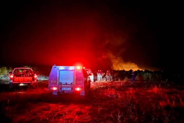 (260823) -- STRUMICA, Aug. 23, 2026 -- Firefighters are seen in an operation to control a spreading wildfire fueled by weeks of extreme summer heat and dry vegetation in Strumica, North Macedonia, Aug. 22, 2026. (Photo by Xinhua) NORTH MACEDONIA-STRUMICA-WILD FIRE TomislavxGeorgiev 