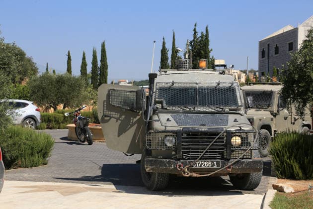 August 23, 2026, Nablus, West Bank, Palestine: Israeli military and police forces arrive at the Palestinian home for questioning after it was set on fire following an attack by a group of Jewish settlers in the village of Osarin, south of Nablus in the West Bank. The settlers attacked homes, torched a Palestinian car in the early morning hours, and wrote Hebrew slogans on the walls calling for revenge against Palestinians. Nablus Palestine - ZUMAs197 20260823_aaa_s197_035 Copyright: xNasserxishatyehx