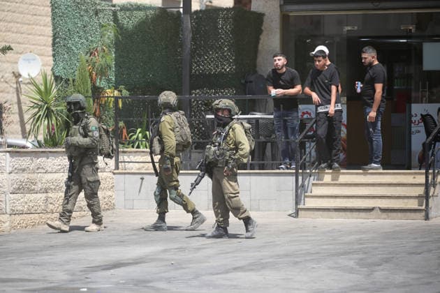 Palestinian-Israeli conflict in Nablus, Palestine - 23 Aug 2026 Israeli soldiers argue with Palestinians in front of their shop during a military operation in the Askar refugee camp. Ajouri was killed during an Israeli military operation in the Askar refugee camp. Israeli forces raided Palestinian shops and homes. A Palestinian medical source reported that a 15-year-old boy was killed by Israeli fire and two others were wounded during stone-throwing clashes in the Askar refugee camp. Nablus Palestine Copyright: xNasserxishatyehx xSOPAxImagesx Nishtayeh175