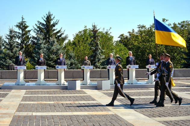 Honour guards carry the Ukrainian flag past Prime Minister of Latvia Andris Kulbergs, President of Finland Alexander Stubb, Prime Minister of Estonia Kristen Michal, President of Ukraine Volodymyr Zelenskyy, Prime Minister of Norway Jonas Gahr Store, President of Lithuania Gitanas Nauseda and Prime Minister of Denmark Mette Frederiksen (L to R) during the State Flag raising ceremony at the National Museum of the History of Ukraine in the Second World War Memorial Complex on National Flag Day, Kyiv, Ukraine, August 23, 2026. (Photo by Yevhen Kotenko Ukrinform) Raising of State Flag of Ukraine in Kyiv  Copyright: xYevhenxKotenkox