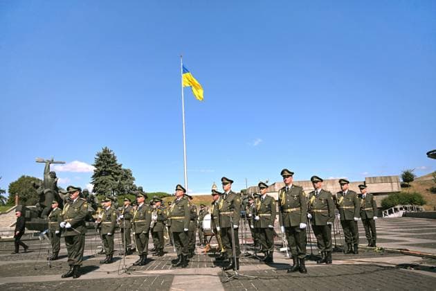 Musicians from a brass band participate in the ceremony to raise the State Flag at the National Museum of the History of Ukraine in the Second World War Memorial Complex on National Flag Day, Kyiv, Ukraine, August 23, 2026. (Photo by Yevhen Kotenko Ukrinform) Raising of State Flag of Ukraine in Kyiv  Copyright: xYevhenxKotenkox