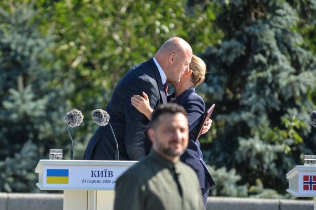 Prime Minister of Latvia Andris Kulbergs and Prime Minister of Denmark Mette Frederiksen share an embrace during the ceremony to raise the State Flag at the National Museum of the History of Ukraine in the Second World War Memorial Complex on National Flag Day, Kyiv, Ukraine, August 23, 2026. (Photo by Yevhen Kotenko Ukrinform) Raising of State Flag of Ukraine in Kyiv  Copyright: xYevhenxKotenkox