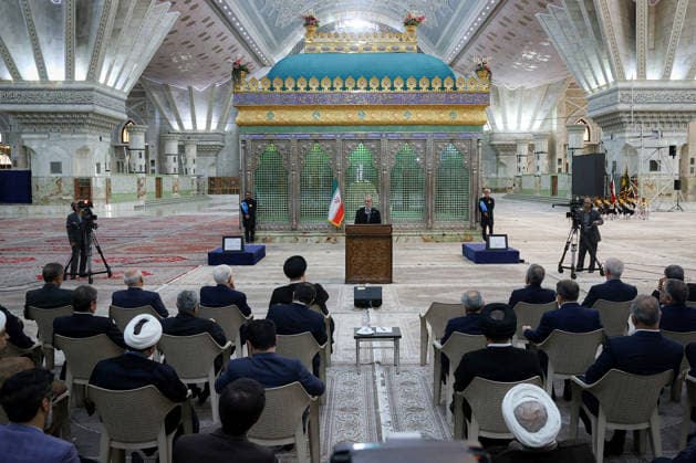 Iranian President Masoud Pezeshkian (C) speaks during an event to mark the first day of the Government Week at the mausoleum of Ayatollah Ruhollah Khomeini, the founder of the Islamic Republic of Iran, in Tehran, Iran on August 23, 2026. Iranian President Masoud Pezeshkian declared that no power will be able to force the Iranian people into surrender. He dismissed claims that sanctions would turn Iran into another Venezuela, saying that has not happened. He stressed the need to begin conserving gasoline consumption through government measures, including a plan to reduce the number and fuel use of government vehicles.  IRN2026082301 IranianxPresidency