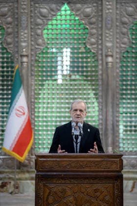 Iranian President Masoud Pezeshkian speaks during an event to mark the first day of the Government Week at the mausoleum of Ayatollah Ruhollah Khomeini, the founder of the Islamic Republic of Iran, in Tehran, Iran on August 23, 2026. Iranian President Masoud Pezeshkian declared that no power will be able to force the Iranian people into surrender. He dismissed claims that sanctions would turn Iran into another Venezuela, saying that has not happened. He stressed the need to begin conserving gasoline consumption through government measures, including a plan to reduce the number and fuel use of government vehicles.  IRN2026082302 IranianxPresidency