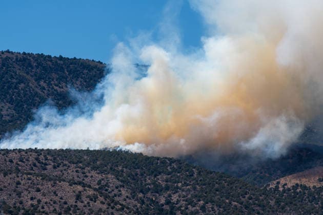 August 23, 2026, Elberta, Utah, USA: Smoke and flames are visible on a hillside as the Big Mountain Fire burns southwest of Elberta, Utah, United States, on August 23, 2026. State and local air and ground resources were deployed to fight the wildland fire, which rapidly reached an estimated 30 acres with zero containment. Elberta USA  - ZUMAm292 20260823_znp_m292_027 Copyright: xCharlesxMcClintockxWilsonx