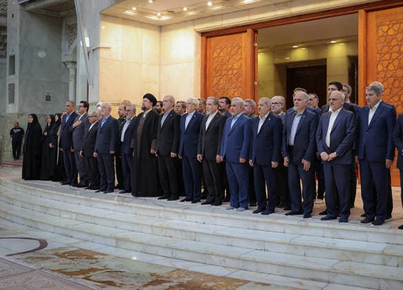 President Masoud Pezeshkian (C) attends an event to mark the first day of the Government Week at the mausoleum of Ayatollah Ruhollah Khomeini, the founder of the Islamic Republic of Iran, in Tehran, Iran on August 23, 2026. Iranian President Masoud Pezeshkian declared that no power will be able to force the Iranian people into surrender. He dismissed claims that sanctions would turn Iran into another Venezuela, saying that has not happened. He stressed the need to begin conserving gasoline consumption through government measures, including a plan to reduce the number and fuel use of government vehicles.  IRN2026082306 IranianxPresidency