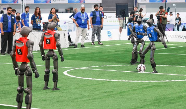 BEIJING, CHINA - AUGUST 23: Robot players compete in the quarterfinal match of the soccer event - 5v5 Large Size Group on day 2 of the 2nd World Humanoid Robot Games at National Speed Skating Oval on August 23, 2026 in Beijing, China.  Copyright: xChinaxNewsxServicex 111661701577