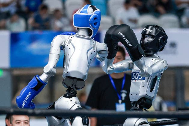 BEIJING, CHINA - AUGUST 23: Robots compete in the Kickboxing event on day 2 of the 2nd World Humanoid Robot Games at National Speed Skating Oval on August 23, 2026 in Beijing, China.  Copyright: xVCGx 111661664133