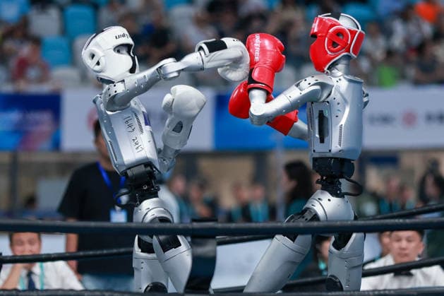 BEIJING, CHINA - AUGUST 23: Robots compete in the Kickboxing event on day 2 of the 2nd World Humanoid Robot Games at National Speed Skating Oval on August 23, 2026 in Beijing, China.  Copyright: xVCGx 111661664143