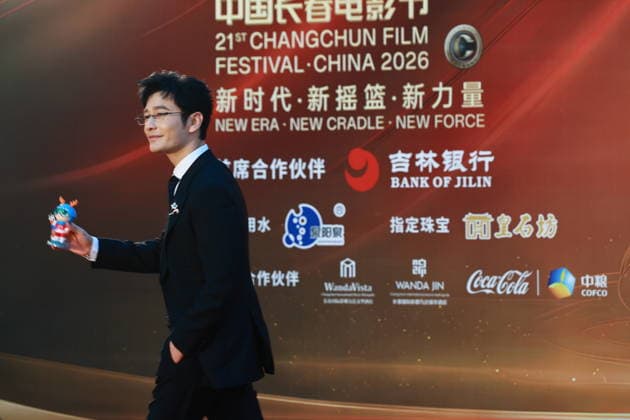 CHANGCHUN, CHINA - AUGUST 23: Actor Huang Xiaoming arrives at the red carpet for the opening of the 21st Changchun Film Festival on August 23, 2026 in Changchun, Jilin Province of China.  Copyright: xVCGx 111661785258