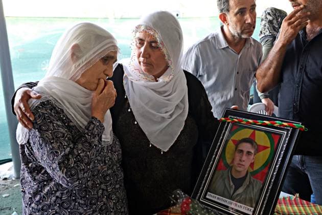 August 23, 2026, Diyarbakir, Turkey: A Kurdish woman is seen crying while looking at a photograph of a guerrilla who died in the conflict during the ceremony. Three days of condolences were established and a memorial program was organized in the city of Diyarbakir in Turkey for 49 Kurdistan Workers Party (PKK) guerrillas who died in armed clashes with the Turkish army on different dates in the past years and whose identities have just been announced. Abdullah Ocalan, the leader of the armed Kurdish PKK party who has been in prison in Turkey for 26 years, had decided two years ago to disarm his party and start peace talks with the state of Turkey. Diyarbakir Turkey  - ZUMAs197 20260823_aaa_s197_374 Copyright: xMehmetxMasumxSuerx