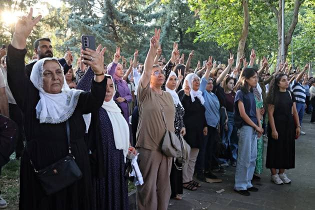 August 23, 2026, Diyarbakir, Turkey: A group of people is seen paying their respects by making the victory sign for the deceased PKK guerrillas during the commemoration ceremony., Three days of condolences were established and a memorial program was organized in the city of Diyarbakir in Turkey for 49 Kurdistan Workers Party (PKK) guerrillas who died in armed clashes with the Turkish army on different dates in the past years and whose identities have just been announced. Abdullah Ocalan, the leader of the armed Kurdish PKK party who has been in prison in Turkey for 26 years, had decided two years ago to disarm his party and start peace talks with the state of Turkey. Diyarbakir Turkey  - ZUMAs197 20260823_aaa_s197_381 Copyright: xMehmetxMasumxSuerx