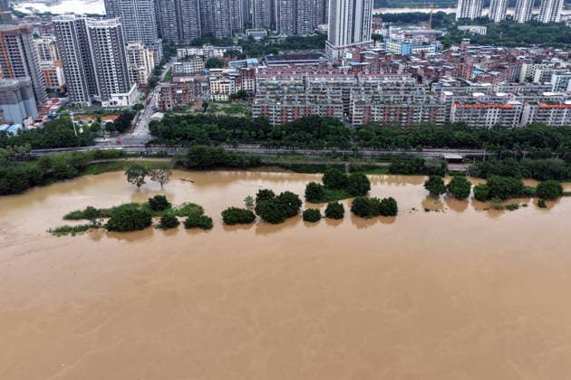 NANNING, CHINA - AUGUST 24: Aerial view of floodwaters submerging riverside park and walkway along the Yong River on August 24, 2026 in Nanning, Guangxi Zhuang Autonomous Region of China. Heavy rainfall brought by Typhoon Narra flooded the low-lying areas in south China s Guangxi Zhuang Autonomous Region.  Copyright: xVCGx 111661812021
