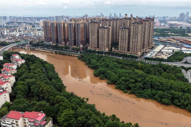 NANNING, CHINA - AUGUST 24: Aerial view of floodwaters submerging riverside park and walkway along the Yong River on August 24, 2026 in Nanning, Guangxi Zhuang Autonomous Region of China. Heavy rainfall brought by Typhoon Narra flooded the low-lying areas in south China s Guangxi Zhuang Autonomous Region.  Copyright: xVCGx 111661812011