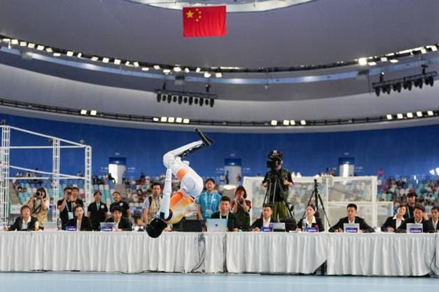 (260824) -- BEIJING, Aug. 24, 2026 -- The robot of Shanghai AGIbot Team competes during the Floor Exercise of Gymnastics event of the 2nd World Humanoid Robot Games in Beijing, capital of China, Aug. 24, 2026. ) (SP)CHINA-BEIJING-WORLD HUMANOID ROBOT GAMES (CN) JuxHuanzong 