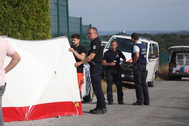 A white tent and police officers pictured inside a large security perimeter was set by police around Onhaye soccer club, Monday 24 August 2026, in Onhaye. Public prosecutor office confirmed a dead body was found but nothing more so far.  BRUNOxFAHY 184186012
