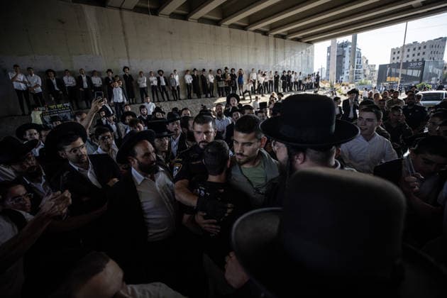 Haredi Jews protest mandatory military service in Bnei Brak BNEI BRAK, ISRAEL - AUGUST 24: Ultra-Orthodox Jews, known as Haredim, gather to protest mandatory military service, blocking one of the city s main roads in Bnei Brak near Tel Aviv, Israel on August 24, 2026. The protesters, wearing traditional black suits, white shirts and black hats, demonstrate against a government bill that proposes fines and other sanctions for those refusing military service. Mostafa Alkharouf Anadolu Bnei Brak Israel. Editorial use only. Please get in touch for any other usage.  Copyright: x2026xAnadoluxMostafaxAlkharoufx