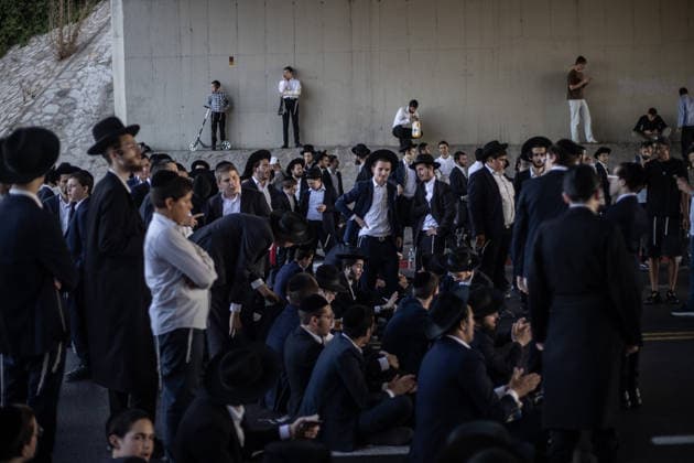Haredi Jews protest mandatory military service in Bnei Brak BNEI BRAK, ISRAEL - AUGUST 24: Ultra-Orthodox Jews, known as Haredim, gather to protest mandatory military service, blocking one of the city s main roads in Bnei Brak near Tel Aviv, Israel on August 24, 2026. The protesters, wearing traditional black suits, white shirts and black hats, demonstrate against a government bill that proposes fines and other sanctions for those refusing military service. Mostafa Alkharouf Anadolu Bnei Brak Israel. Editorial use only. Please get in touch for any other usage.  Copyright: x2026xAnadoluxMostafaxAlkharoufx