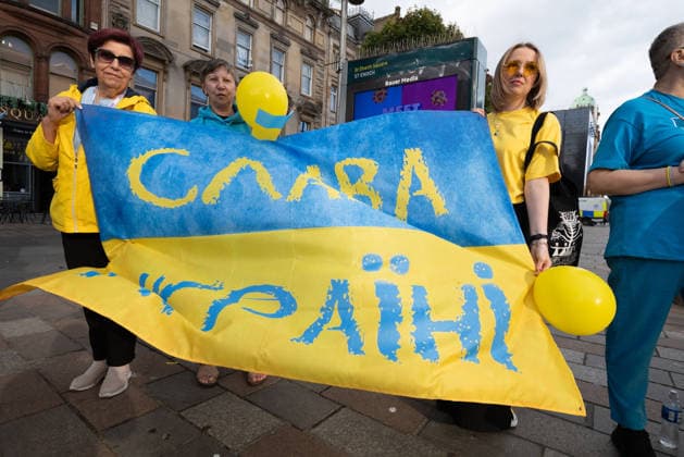 August 24, 2026, Glasgow, Scotland, UK: Members of Scotlands Ukrainian community gathered in Glasgow to mark the 35th anniversary of Ukraines independence. The event included a minutes silence and shared prayer, speeches, the formation of a large human Ukrainian flag, and the international Chain of Unity and The Free World Gathering, connecting Ukrainians and supporters of Ukraine in cities around the world. Glasgow UK  - ZUMAs357 20260824_zip_s357_004 Copyright: xCameronxScottx
