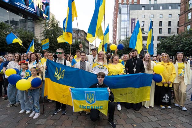 August 24, 2026, Glasgow, Scotland, UK: Members of Scotlands Ukrainian community gathered in Glasgow to mark the 35th anniversary of Ukraines independence. The event included a minutes silence and shared prayer, speeches, the formation of a large human Ukrainian flag, and the international Chain of Unity and The Free World Gathering, connecting Ukrainians and supporters of Ukraine in cities around the world. Glasgow UK - ZUMAs357 20260824_zip_s357_010 Copyright: xCameronxScottx