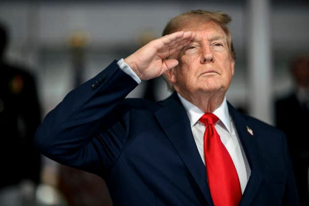 August 24, 2026, Washington, Dc, United States: U.S. President Donald Trump, salutes during the national anthem before the start of the Freedom 250 Grand Prix Race, August 23, 2026 in Washington, D.C. Washington United States - ZUMAp138 20260824_zaa_p138_018 Copyright: xDanielxTorok WhitexHousex