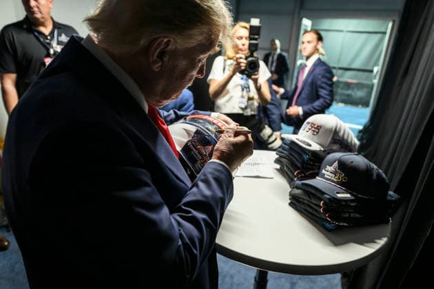August 24, 2026, Washington, Dc, United States: U.S. President Donald Trump, signs a drivers helmet before the start of the Freedom 250 Grand Prix Race, August 23, 2026 in Washington, D.C. Washington United States - ZUMAp138 20260824_zaa_p138_028 Copyright: xDanielxTorok WhitexHousex