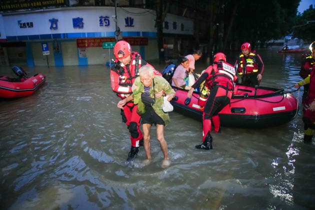 LONGZHOU, CHINA - AUGUST 24: Rescue workers evacuate residents trapped by floods caused by heavy rainfall from Typhoon Zitan and upstream water flow on August 24, 2026 in Longzhou, Guangxi Zhuang Autonomous Region of China. The water level of the Zuo River in Longzhou county has continued to rise, submerging some urban roads, while local flood control departments are monitoring water conditions and rescue operations are ongoing.  Copyright: xChinaxNewsxServicex 111661931435