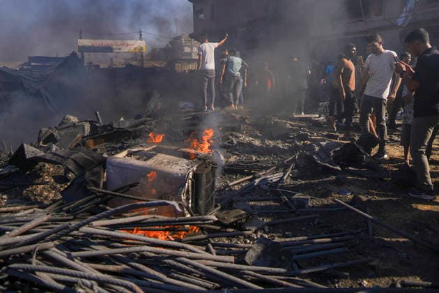 Water Desalination Plant Strike Gaza City Palestinians stand near a fire burning in the rubble of a destroyed water desalination plant in the Sheikh Radwan neighborhood in Gaza City, Gaza Strip, on August 24, 2026. The facility was targeted after an Israeli army officer called a local resident to issue an evacuation warning for the area near the Ahli Club, resulting in no reported casualties. Gaza Gaza Strip Palestinian Territories Copyright: xMohammedxAlxQumsanx