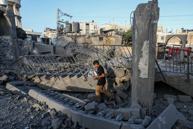 Abu Salim Mosque severely damaged in Israeli airstrike in Deir al-Balah DEIR AL-BALAH, GAZA, PALESTINE - AUGUST 25: A young Palestinian is seen among the rubble of the heavily damaged Abu Salim Mosque and surrounding neighborhood following an Israeli airstrike carried out despite the ceasefire in Deir al-Balah, in the central Gaza Strip, Palestine on August 25, 2026. The strike caused widespread collapse, reduced parts of the religious building to rubble, and damaged nearby residential structures and streets across the area. Moiz Salhi Anadolu Deir al-Balah Gaza. Editorial use only. Please get in touch for any other usage.  Copyright: x2026xAnadoluxMoizxSalhix