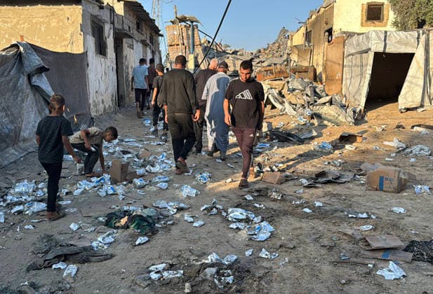 Palestinians Inspect Damage After Israeli Strike in Deir el-Balah Palestinians inspect destruction caused by an Israeli strike that hit residents’ homes, displacement tents and a food aid warehouse in Deir el-Balah, in the central Gaza Strip, on August 25, 2026. The strike took place the previous evening after an Israeli warning ordering residents to evacuate the area. Photo by Ahmed Ibrahim apaimages Deir al-Balah Gaza Palestinian Territory 250826_Deir_al-Balah_AI_00(1) Copyright: xapaimagesxAhmedxIbrahimx xapaimagesx