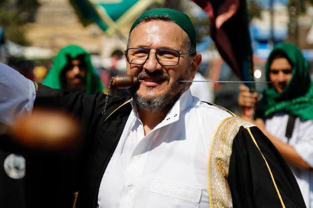 August 25, 2026, Saida, Saidon District, lebanon: Sufi devotees take part in a procession marking the birthday of Prophet Muhammad in the old city of Sidon, Lebanon. The procession began outside the RifaÃ¢â‚¬â ¢i Sufi lodge and moved through the historic streets accompanied by drums, chanting, swords and shields. Some devotees performed the traditional Ã¢â‚¬oeShishÃ¢â‚¬Â ritual, associated with certain RifaÃ¢â‚¬â ¢i Sufi communities, involving the piercing of the body with metal skewers during intense religious chanting. Residents distributed sweets and sprayed rose water as the procession passed. Saida lebanon - ZUMAb339 20260825_znp_b339_007 Copyright: xAbdulxKaderxAlxBayx