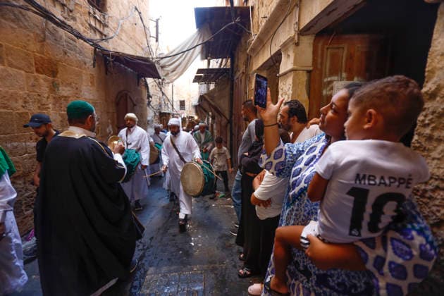 August 25, 2026, Saida, Saidon District, lebanon: Sufi devotees take part in a procession marking the birthday of Prophet Muhammad in the old city of Sidon, Lebanon. The procession began outside the RifaÃ¢â‚¬â ¢i Sufi lodge and moved through the historic streets accompanied by drums, chanting, swords and shields. Some devotees performed the traditional Ã¢â‚¬oeShishÃ¢â‚¬Â ritual, associated with certain RifaÃ¢â‚¬â ¢i Sufi communities, involving the piercing of the body with metal skewers during intense religious chanting. Residents distributed sweets and sprayed rose water as the procession passed. Saida lebanon - ZUMAb339 20260825_znp_b339_008 Copyright: xAbdulxKaderxAlxBayx