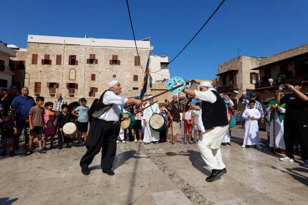 August 25, 2026, Saida, Saidon District, lebanon: Sufi devotees take part in a procession marking the birthday of Prophet Muhammad in the old city of Sidon, Lebanon. The procession began outside the RifaÃ¢â‚¬â ¢i Sufi lodge and moved through the historic streets accompanied by drums, chanting, swords and shields. Some devotees performed the traditional Ã¢â‚¬oeShishÃ¢â‚¬Â ritual, associated with certain RifaÃ¢â‚¬â ¢i Sufi communities, involving the piercing of the body with metal skewers during intense religious chanting. Residents distributed sweets and sprayed rose water as the procession passed. Saida lebanon - ZUMAb339 20260825_znp_b339_012 Copyright: xAbdulxKaderxAlxBayx