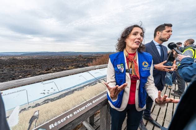 Walloon Minister President Adrien Dolimont and EU Commissioner for Equality, Preparedness and Crisis Management Hadja Lahbib pictured at a visit at the Botrange panorama deck, in Waimes, on Tuesday 25 August 2026. European commissionner Lahbib visit several sites regarding the fire in the Hautes Fagnes (Hugh Fens) wich started on August 14th with 3000 hectares (on a total of 4500) impacted in the nature reserve.  EMILExWINDAL 184245101
