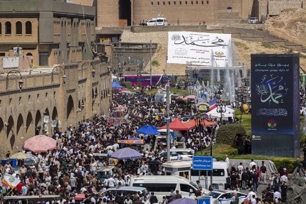 Iraqis gather in Erbil to mark Mawlid al-Nabi ERBIL, IRAQ - AUGUST 25: People gather in decorated streets and shop at the historic Qaysari Bazaar near the Erbil Citadel during Mawlid al-Nabi celebrations in Erbil, Iraq, on August 25, 2026. Marking the birth anniversary of Prophet Muhammad, streets and public squares across the city were adorned with lights and banners as residents and visitors visited local markets to shop and buy traditional sweets. Ahsan Mohammed Ahmed Ahmed Anadolu Erbil Iraq. Editorial use only. Please get in touch for any other usage.  Copyright: x2026xAnadoluxAhsanxMohammedxAhmedxAhmedx