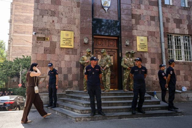 ARMENIA, YEREVAN - AUGUST 25, 2026: Law enforcement officers patrol the area outside the building of the Armenian Anti-Corruption Committee. The Armenian Anti-Corruption Committee accuses former Armenian President Robert Kocharyan (1998-2008) of using his official position to acquire property at a price below its market value. Alexander Patrin TASS  96628281