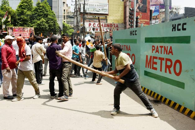 Students stage a protest demanding cancellation of the 70th BPSC examination Patna, Aug 25 (ANI): A man wields a long wooden pole during a march towards Raj Bhavan from Gandhi Maidan, demanding cancellation of the 70th BPSC examination, in Patna on Tuesday. Patna Bihar India Copyright: xANIx ANI_20260825240