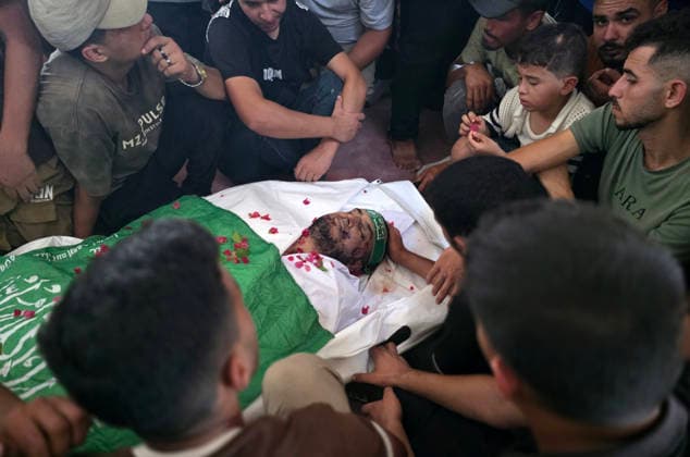 Palestinians Bury Three People in Khan Younis Palestinians attend the funeral of three people in Khan Younis, in the southern Gaza Strip, on August 25, 2026. Two died from wounds sustained in previous Israeli strikes, while the third was killed in an Israeli strike the previous evening. Photo by Tariq Mohammad APA Images Khan Yunis Gaza Strip Palestinian Territory 250826_Khan_Yunis_TM_04(18) Copyright: xapaimagesxTariqxMohammad xapaimagesx
