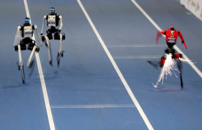 BEIJING, CHINA - AUGUST 25: Humanoid robots compete in the 100-meter large group event on day 4 of the 2nd World Humanoid Robot Games at National Speed Skating Oval on August 25, 2026 in Beijing, China.  Copyright: xBeijingxYouthxDailyx 111662137680