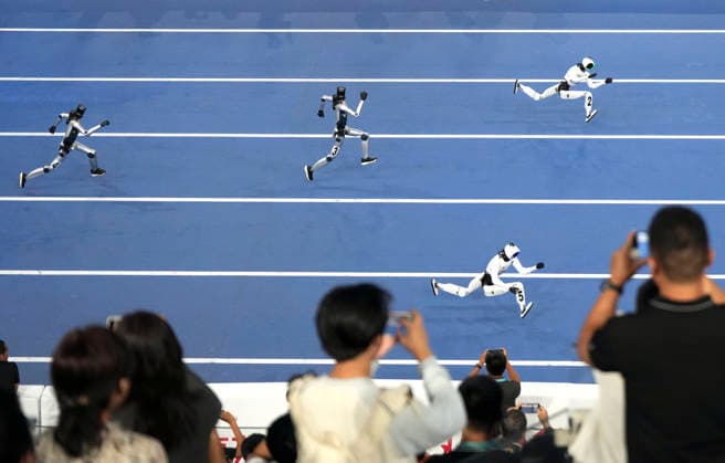 BEIJING, CHINA - AUGUST 25: Humanoid robots compete in the 100-meter small group event on day 4 of the 2nd World Humanoid Robot Games at National Speed Skating Oval on August 25, 2026 in Beijing, China.  Copyright: xBeijingxYouthxDailyx 111662137687
