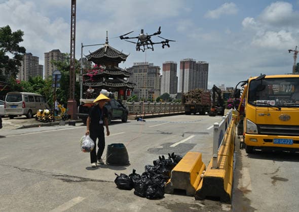 (260825) -- CHONGZUO, Aug. 25, 2026 -- A rescuer operates a drone to transport supplies in Ningming Couty, Chongzuo City, south China s Guangxi Zhuang Autonomous Region, Aug. 25, 2026. Continuous heavy rainfalls caused by Typhoon Narra, the 19th typhoon of the year, have swept many areas in Ningming. Local authorities have fully engaged in rescue and relief efforts. As of 12:00 p.m. (Beijing Time) on Tuesday, 22,008 stranded civilians had been transferred. ) CHINA-GUANGXI-NINGMING-TYPHOON-STRANDED RESIDENTS-TRANSFER (CN) ZhouxHua 