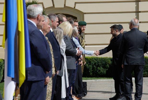 Ukrainian President Volodymyr Zelenskyy (L) and Estonian President Alar Karis (R) meet delegations outside the Mariinskyi Palace ahead of their meeting, Kyiv, Ukraine, August 25, 2026. The leaders discussed security threats, particularly those anticipated in winter, and security cooperation within the Drone Deal framework. As reported, the Estonian President is in Ukraine on his final visit in office. (Photo by Marianna Kotyk Ukrinform) Meeting of Ukrainian, Estonian Presidents in Kyiv  Copyright: xMariannaxKotykx