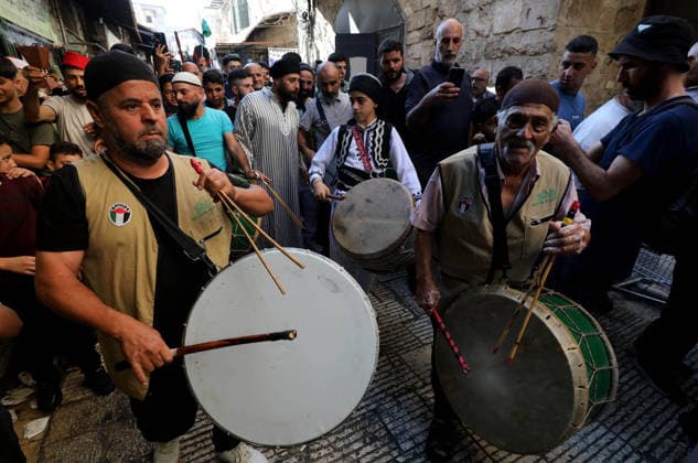 Mawlid al-Nabi in Nablus NABLUS, WEST BANK, PALESTINE - AUGUST 25: Palestinian religious figures and residents take part in a street procession to mark Mawlid al-Nabi, the anniversary of the birth of Prophet Muhammad, in Nablus, West Bank, Palestine on August 25, 2026. Participants wearing traditional clothing chant religious songs accompanied by tambourines and drums during the celebrations. Nedal Eshtayah Anadolu Nablus West Bank. Editorial use only. Please get in touch for any other usage.  Copyright: x2026xAnadoluxNedalxEshtayahx